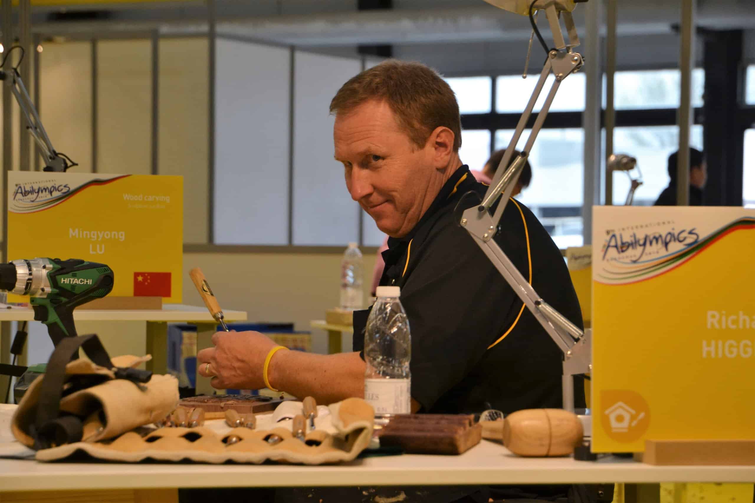 Richard Higgins competing in the wood carving event